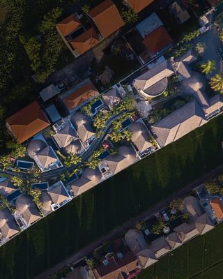 Aerial view of private pool villas with thatched roofs, The Bidadari, Bali